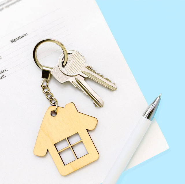 Image showing house keys and pen on top of a  contract
